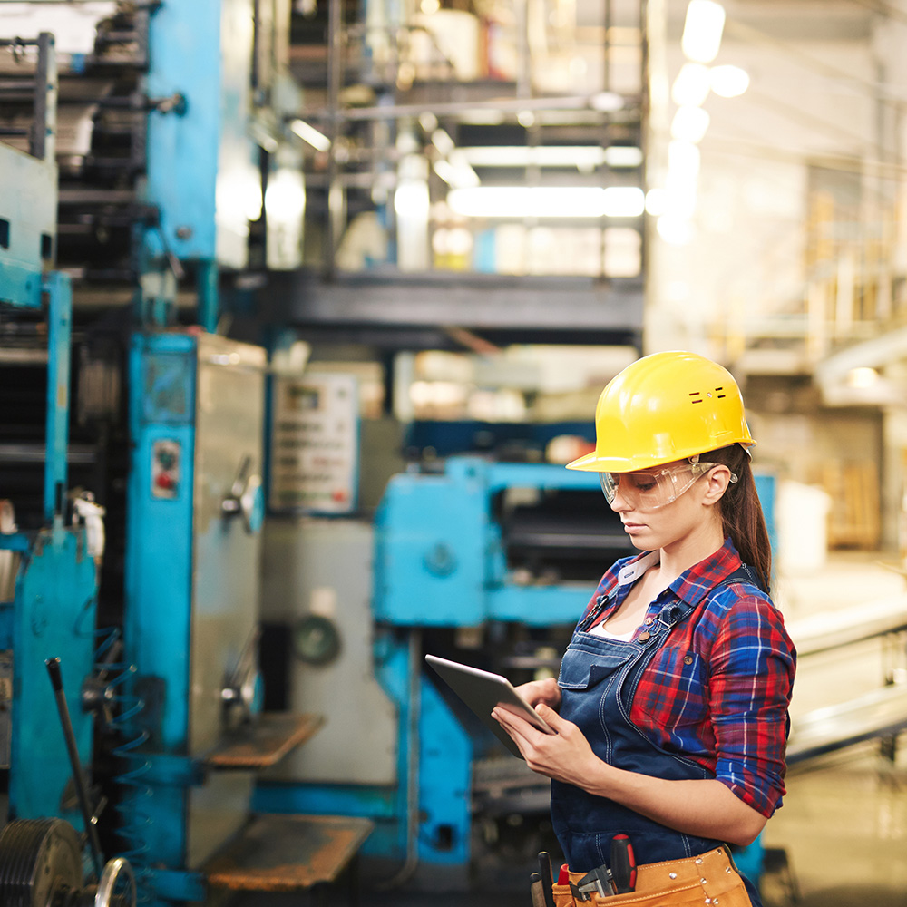 engineer examining plastic molds' quality