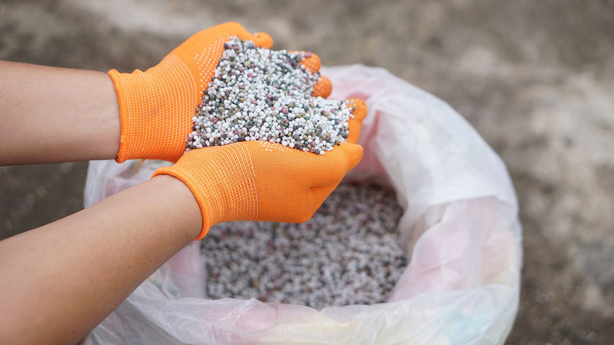 a handful of plastic pellets mixed with plasticizers